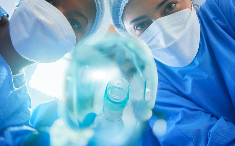 Surgery, anesthesia and doctors with oxygen mask for medical service, operation and procedure. Heal.