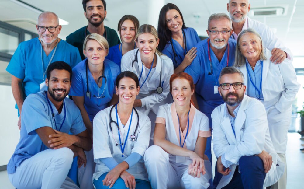 Portrait of happy doctors, nurses and other medical staff in a hospital.