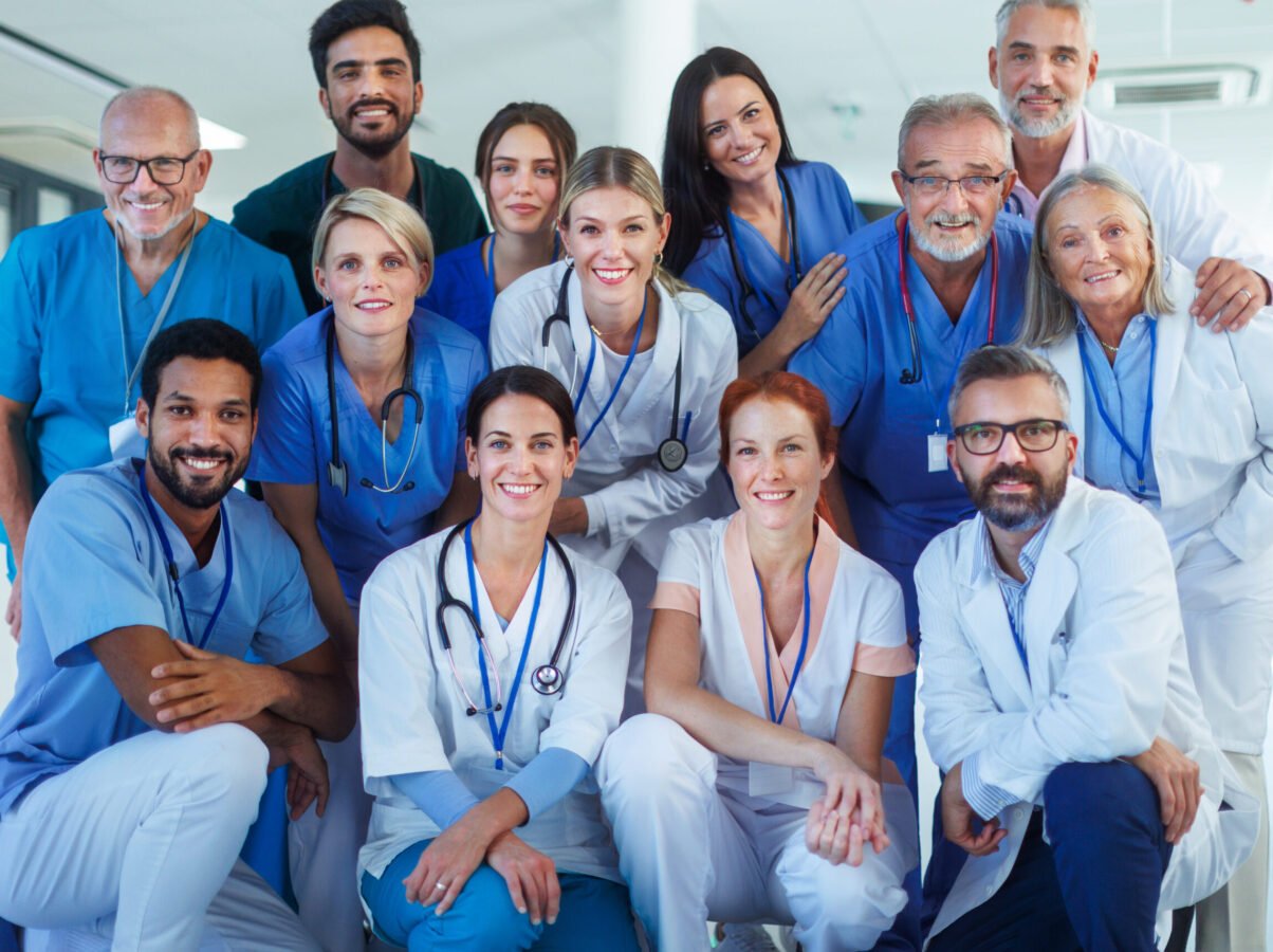 Portrait of happy doctors, nurses and other medical staff in a hospital.